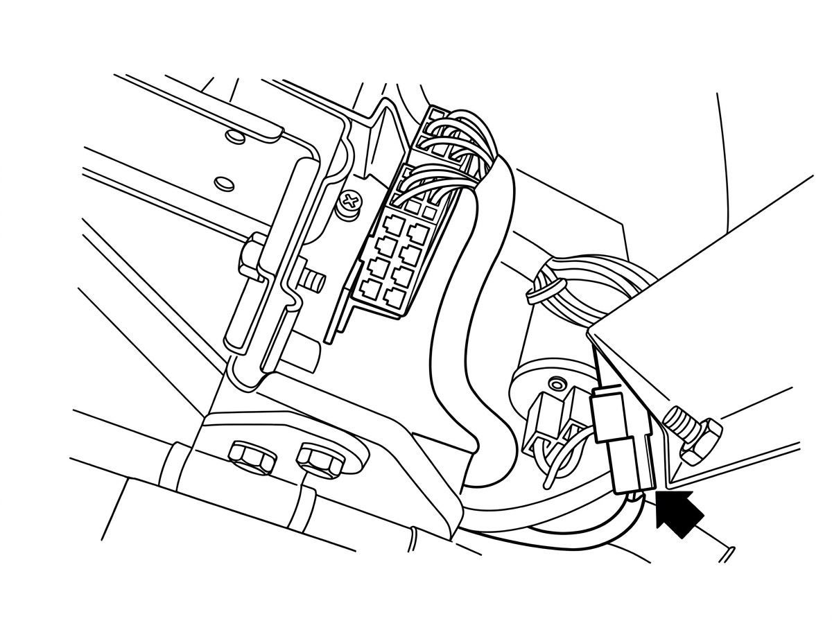 Photo of the fuel injection control unit mounted in the kick panel area, with an arrow pointing to the ignition lead wire connector