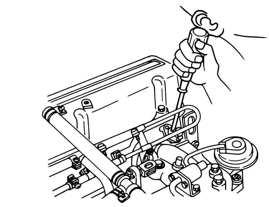 Photo of a hand pulling the ignition lead wire connector at the fuel rail while listening to the injectors
